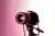 Picture of a camera with pink background