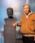 Kwik Kian Gie with the statue of Tinbergen