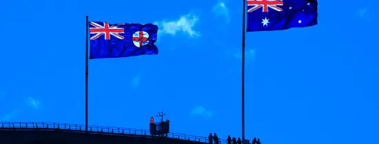 a silhoutte of Sydney Harbour Bridge, The Rocks NSW, Australia with the Australian flag out