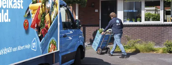An employee delivers groceries from Albert Heijn.